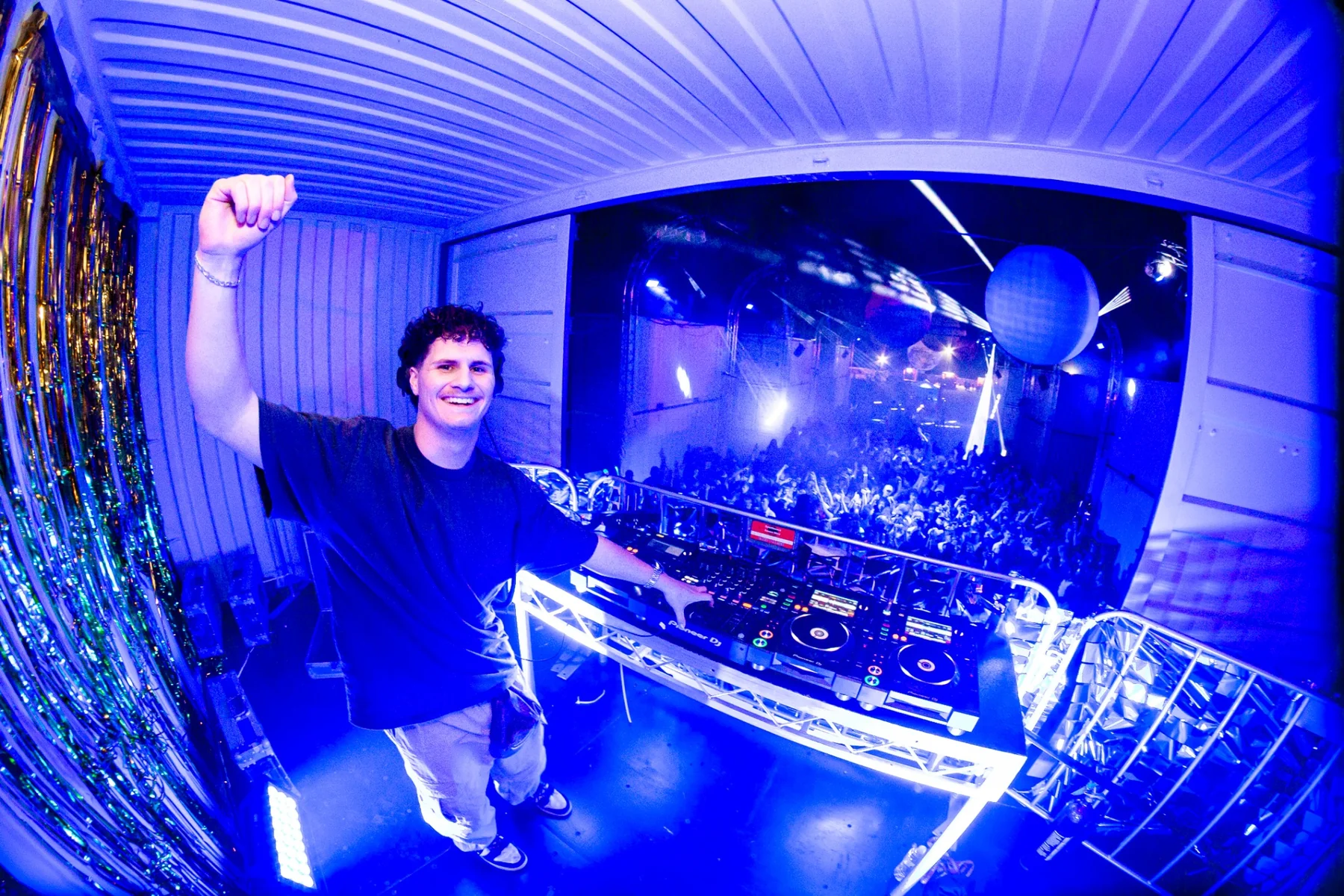 HASLOOM smiling behind the DJ booth at Leavers